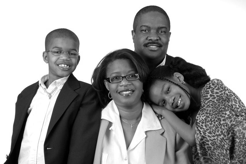 Family with formal attire over a white blackground